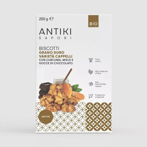 Confezione bianca di biscotti Antiki Sapori con curcuma, miele e gocce di cioccolato, 200g.