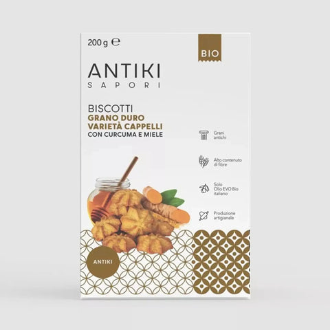 Confezione bianca di Biscotti Antiki Sapori con curcuma e miele, grano duro Cappelli, logo BIO e icone ingredienti.