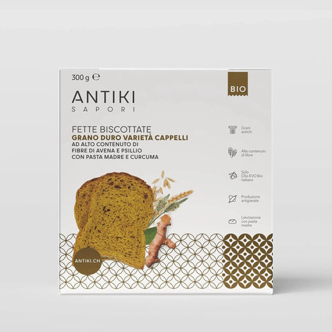 Confezione bianca di fette biscottate Antiki con curcuma, fibra di acacia e psillio, grani Cappelli.