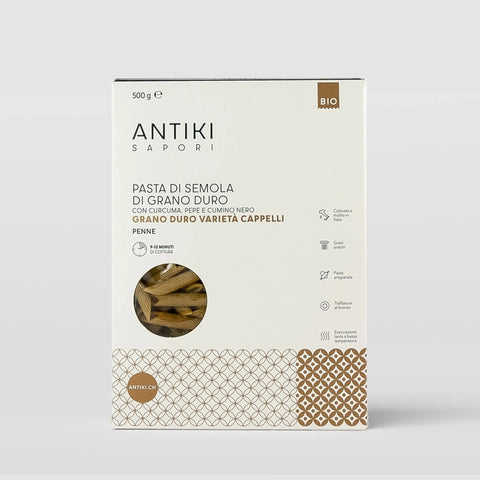 Confezione bianca di penne di grano duro antico Cappelli con curcuma e pepe nero, 500g, trafilate al bronzo.